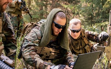 Troops in the field with laptops