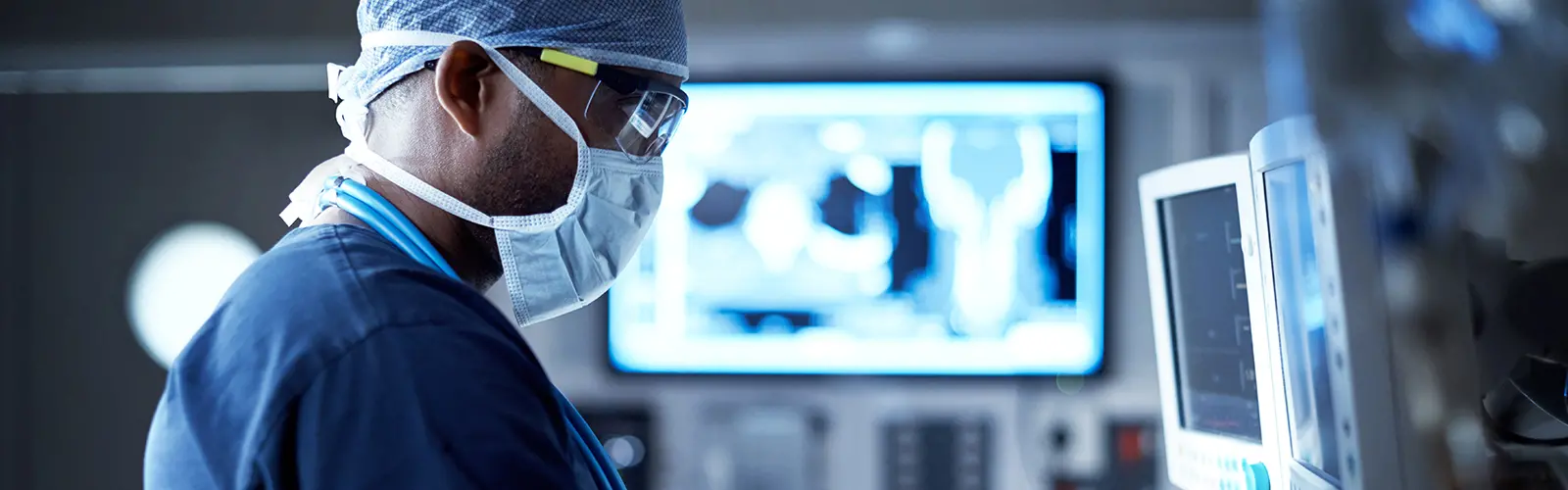 Medical worker looking at testing screens