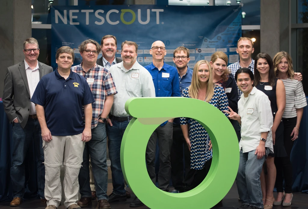 Netscout employees with oversized logo