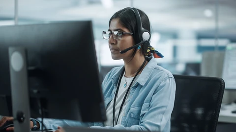 Woman using headset on a Teams Meeting.