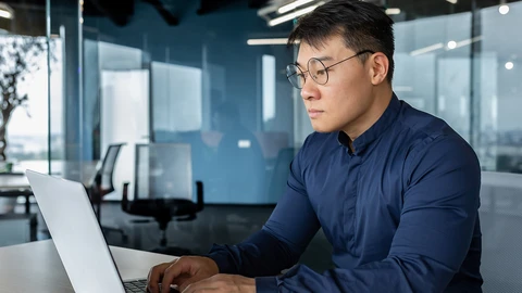 Man working on laptop at remote site