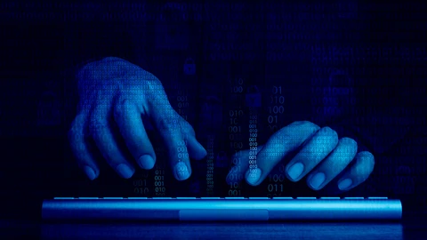 hands on keyboard in the dark