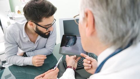 Men reviewing medical image