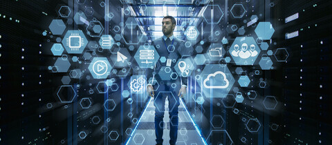 Gentlemen in datacenter with different application images floating around him.