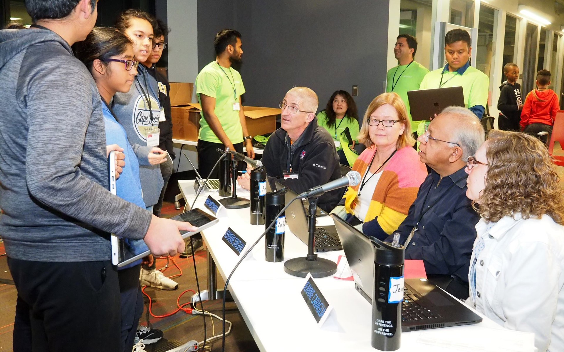 Small group of students presenting their project to NETSCOUT volunteer judges